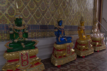 Statues of four Buddhas of different colors (green, blue, yellow and white)