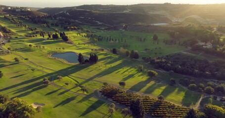 Aerial view of golf courses in a beautiful landscape. Outdoor sports games. High quality 4k footage