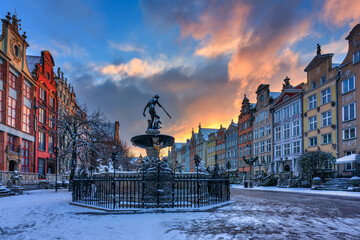 Sunrise in the historic center of Gdansk at the Neptune Fountain, Poland.
