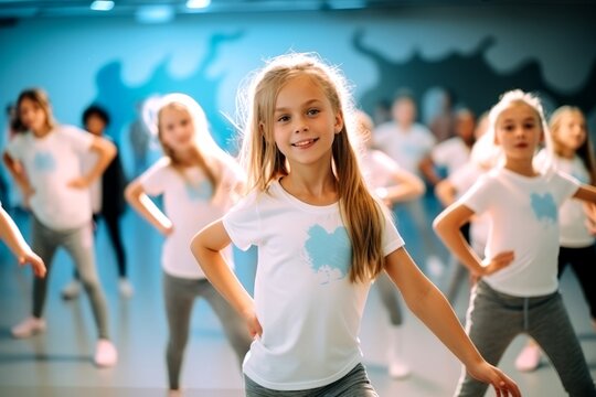 Portrait of smiling children of 7-13 years old enjoying modern dancing in a dance studio