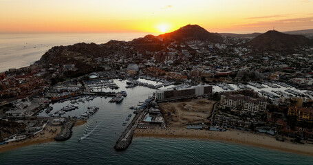 Cabo San Lucas Mexico City Bay Harbor Downtown Sunrise Flare Light Behind Mountain Aerial perspective
