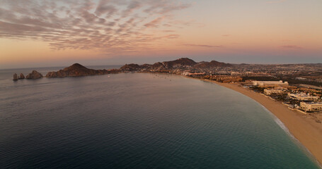 Orange Horizon Aerial Shot Panoramic View Sunrise Over Cabo San Lucas Beach and City Mexico Baja California