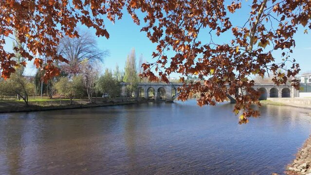 Hiker's point of view along the Tamega river city park in Chaves, Portugal.