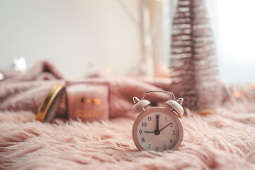 Clock in a festive New Year's atmosphere, pink mood