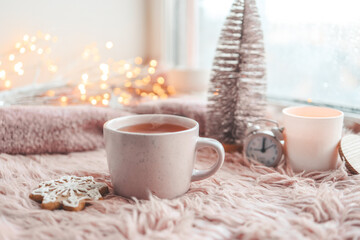 Cup of tea with steam in winter morning atmosphere