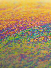 Obraz premium Brightly colored background from the approach to a soap bubble.