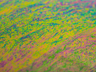 Brightly colored background from the approach to a soap bubble.