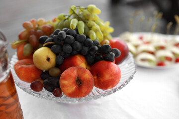 plate of ripe fresh fruits at a banquet