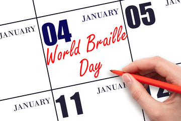 January 4. Hand writing text World Braille Day on calendar date. Save the date.