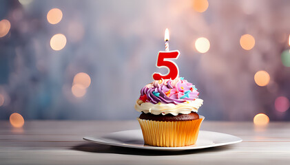 Birthday cupcake with lit birthday candle Number five for five years or fifth anniversary