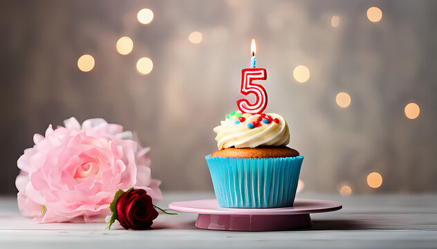 Birthday cupcake with lit birthday candle Number five for five years or fifth anniversary