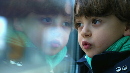 Pensive Child Leaning on Train Window, Close-Up Profile of Thoughtful Kid Observing the World with...