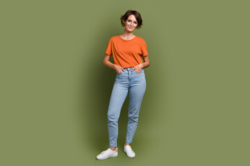 Full size photo of gorgeous satisfied woman wear stylish t-shirt in glasses hold palms in pockets...