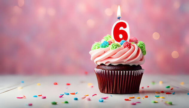 Birthday cupcake with lit birthday candle Number six for six years or sixth anniversary