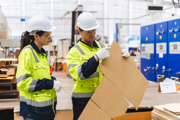 Professional worker team in safety uniform, supervisor inspector in packaging stock order at...