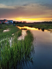 Waterfront houses along the marsh in Oak Island NC at sunset