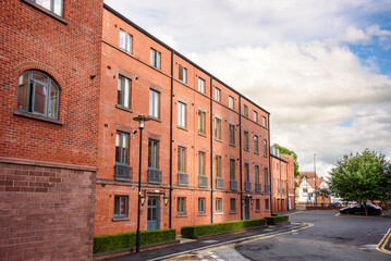 Renovated block of flats in a residential district on a partly cloudy summer day