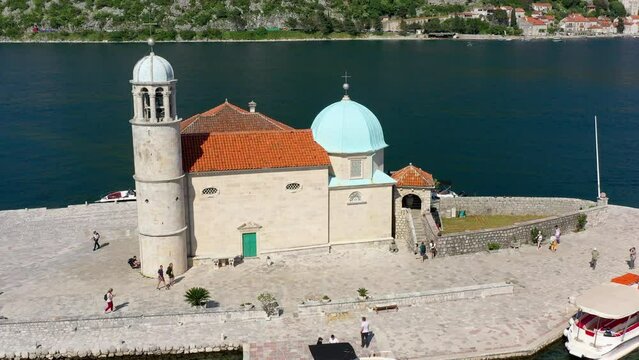 Saint George Island and Church of Our Lady of the Rocks in Perast, Montenegro. Our Lady of the Rock island and Church in Perast on shore of Boka Kotor bay (Boka Kotorska), Montenegro, Europe.