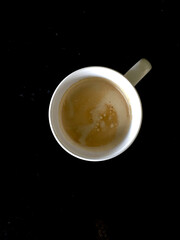 top view cup of coffee on black background