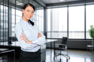 Beautiful business woman smiling at camera in office