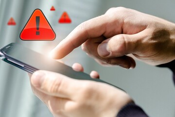 People hands with warning message icon on phone