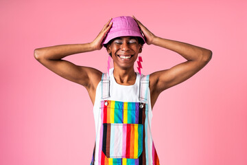 Fashionable homosexual man posing in studio - Fluid gender non binary hispanic  man posing in...