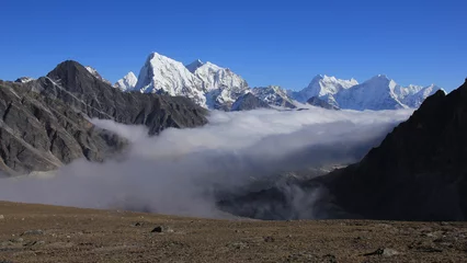 Papier Peint photo Ama Dablam Sea of fog in the Gokyo Valley and snow capped high mountains of the Himalayas, Nepal.