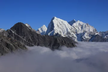 Papier Peint photo Ama Dablam Autumn day above the clouds in the Himalayas, Nepal.
