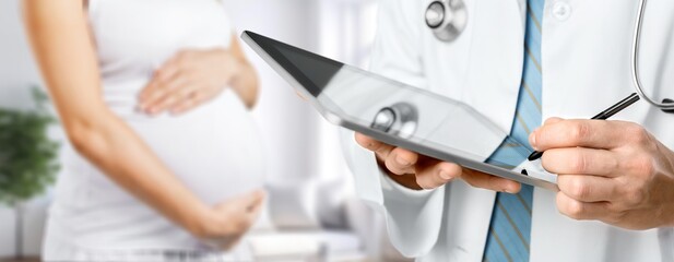 Pregnant woman at doctor's consultation. immune system - obrazy, fototapety, plakaty