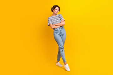 Full length photo of confident lovely girl dressed stylish clothes summer collection isolated on yellow color background - obrazy, fototapety, plakaty