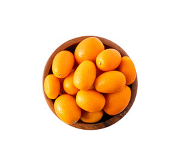 Cumquat or kumquat in bowl isolated on white background close up. Top view.