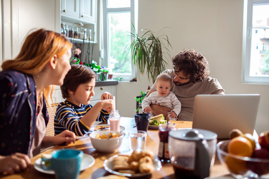 Family Breakfast Time with Newborn and Child