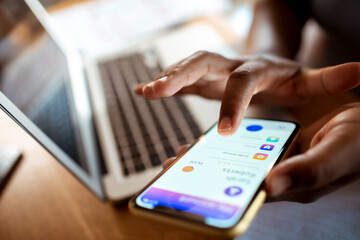 Close up woman hand using smartphone with bank app