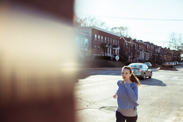 Active Woman Jogging in Urban Neighborhood