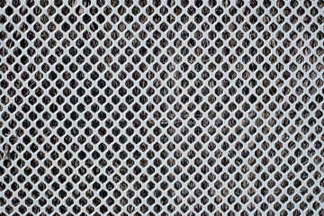 metal texture of perforated geometric holes