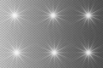 Set of highlights. Flashes of rays of light. The effect of glow, radiance, shine. Collection of various glowing sparks, stars. On a transparent background.