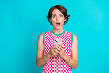 Photo of checkered bright dress young girl open mouth astonished read new york times magazine phone...