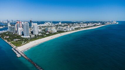 Fototapeta premium Aerial view of Miami beach coast capture by a drone in Miami Beach, FL, USA in a sunny day
