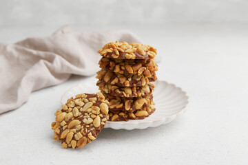 A heap of Portugues traditional peanut cookies known as Bolachas de Amendoim on the white plate