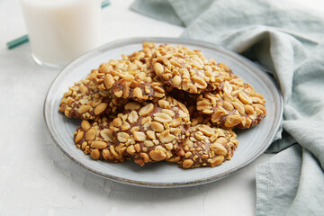A heap of Portugues traditional peanut cookies known as Bolachas de Amendoim on the grey plate