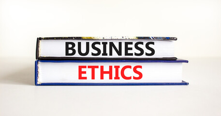 Business ethics symbol. Concept words Business ethics on beautiful books. Beautiful white table white background. Business ethics concept. Copy space.