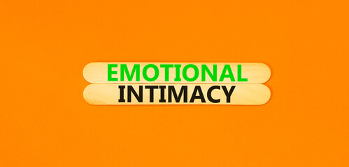 Emotional intimacy symbol. Concept words Emotional intimacy on beautiful wooden stick. Beautiful orange table orange background. Psychology emotional intimacy concept. Copy space.