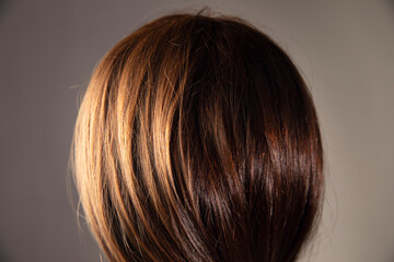 woman holding a magnifying glass in her hair