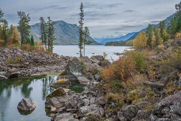 Autumn view of the amazingly beautiful Lake Teletskoye, Lost World, Altai Mountains, Russia.