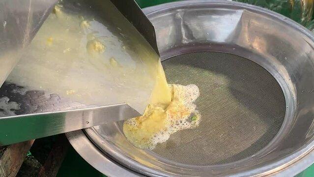 Man make eco sugarcane juice. Rural guy produce sweet rum drink. Street vendor chop up raw cane fiber. Local maker sell sugar sap. Grinder mill crush sugarcanes fibre. Slow motion Video. Hand work. 4K