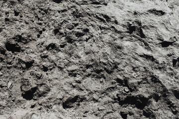 Black volcanic rock texture. Basalt background. Tenerife island. Closeup geology pattern. Grunge mineral dark background. Gray stone structure.