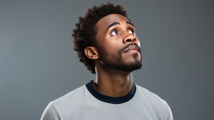 Meditative and uncertain, thoughtful african-american man, touching beard, scowling and looking up