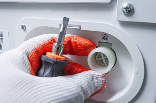 Service Engineer Checking The Water Filter Of The Washing Machine Inlet Valve. Cleaning The Water Hose Mesh Filter.