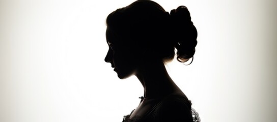  the silhouette of a woman's head is shown against a white background with a light shining through the shadow of the woman's head.