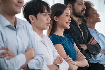 Diverse group of professional business people stand in line with cross arm gesture in modern...